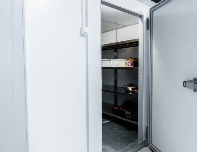 Refrigerator room door in professional kitchen in restaurant close up